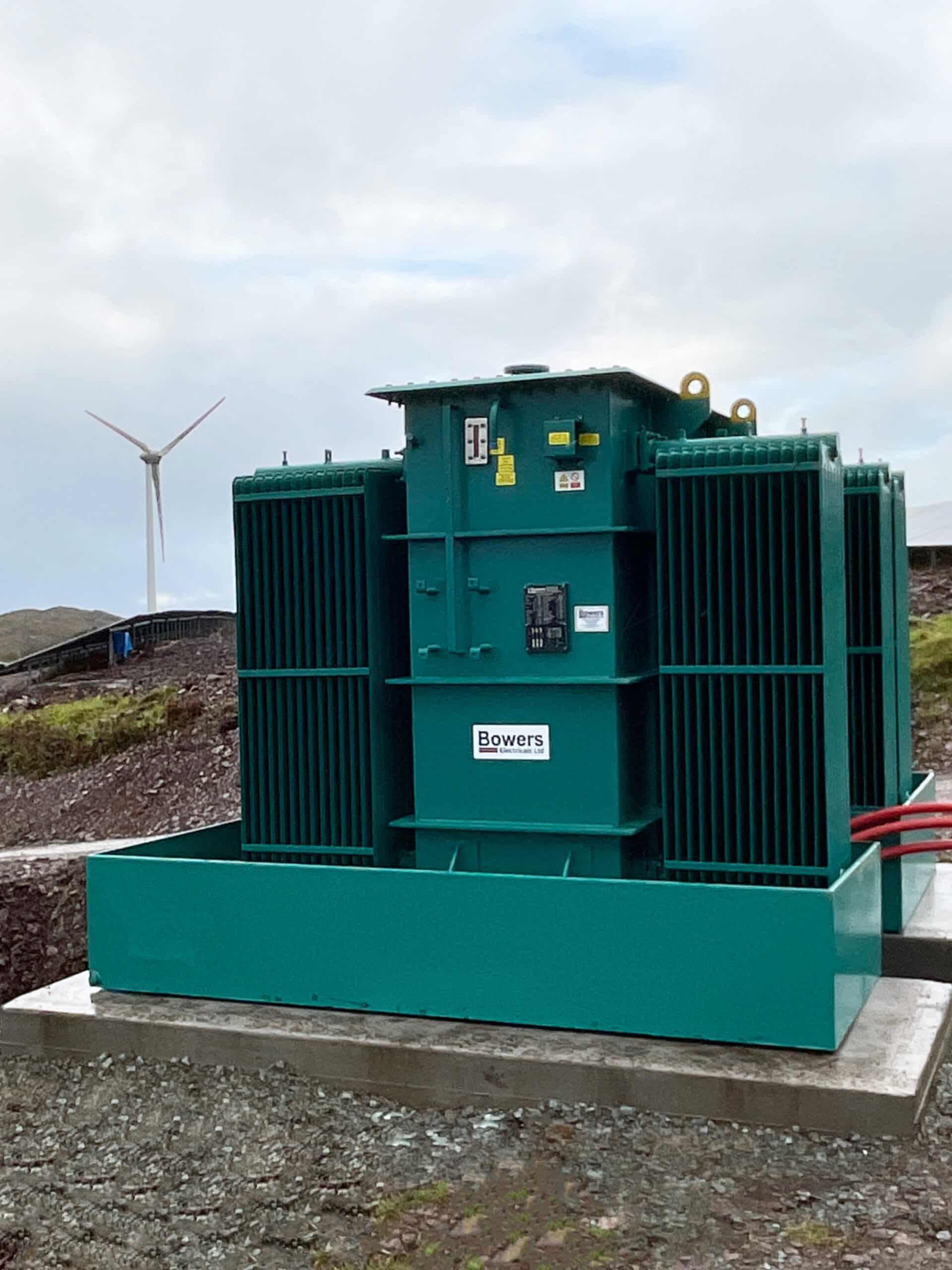 Teal coloured Distribution transformer on site